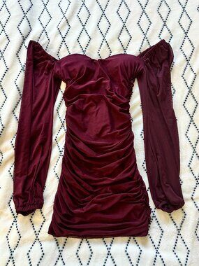 burgundy velvet bodycon mini dress with ruched details and long sleeves